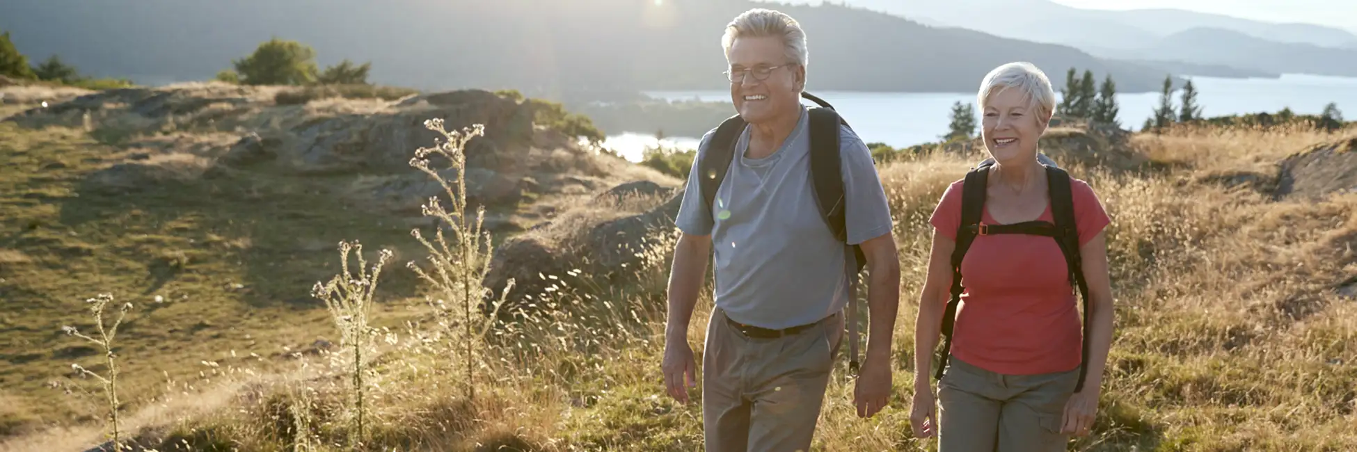 Couple in their seventies sailing—tax-aware retirement planning and benefits coordination